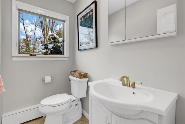 bathroom with a baseboard radiator, toilet, and tile patterned flooring