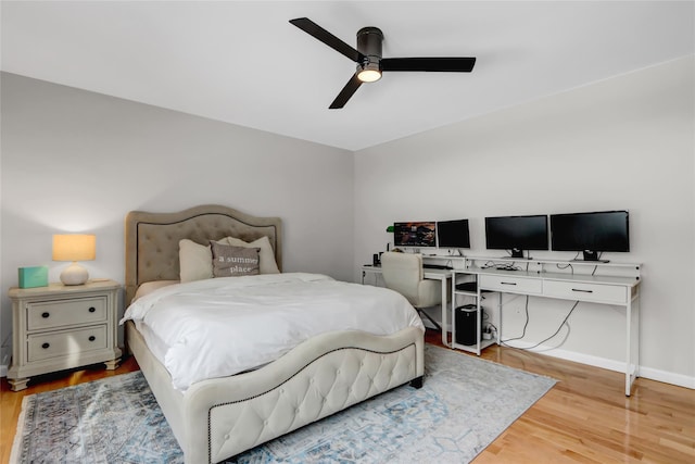 bedroom with light hardwood / wood-style floors and ceiling fan