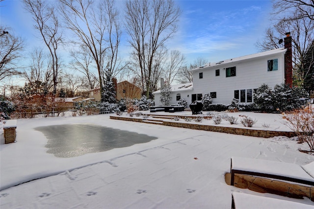 view of yard layered in snow