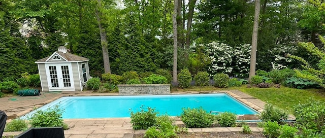 view of pool featuring an outdoor structure