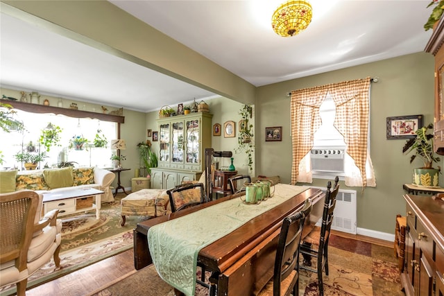 dining space featuring radiator and a wealth of natural light