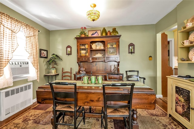 dining room featuring hardwood / wood-style floors and radiator heating unit