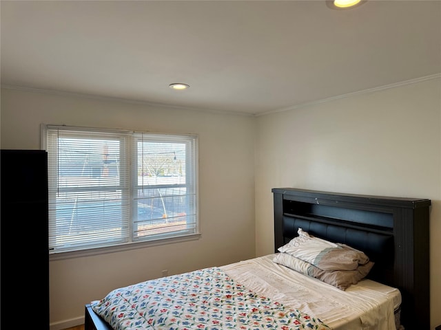 bedroom featuring recessed lighting and crown molding