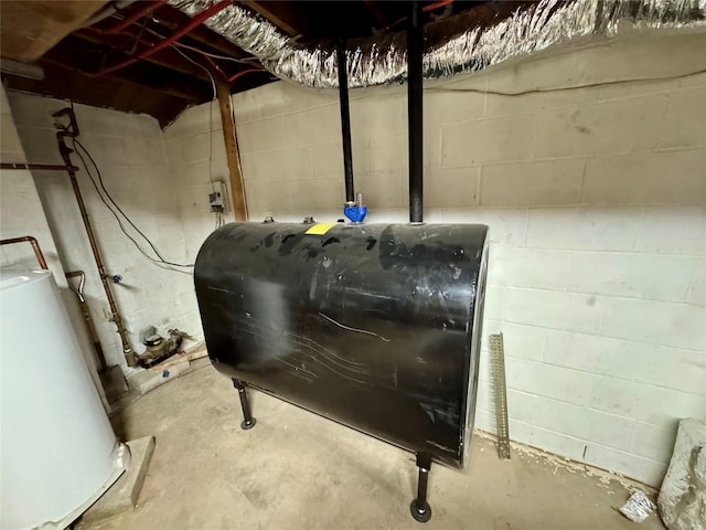 utility room featuring water heater and heating fuel