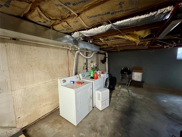 unfinished below grade area featuring separate washer and dryer