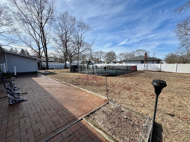 exterior space featuring a fenced backyard and a swimming pool