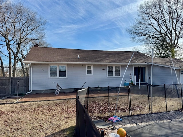 back of property with fence