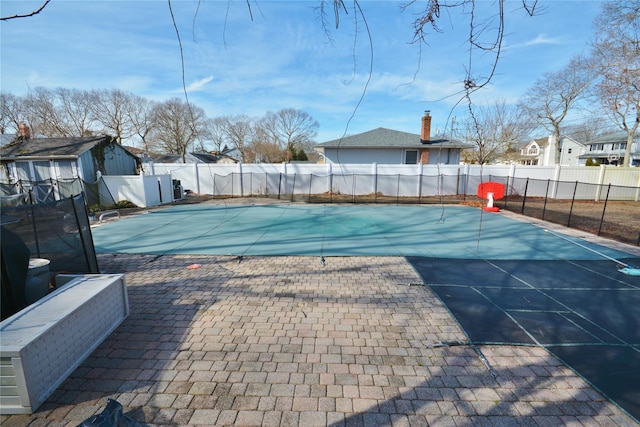 view of swimming pool with a patio area, a fenced backyard, and a fenced in pool