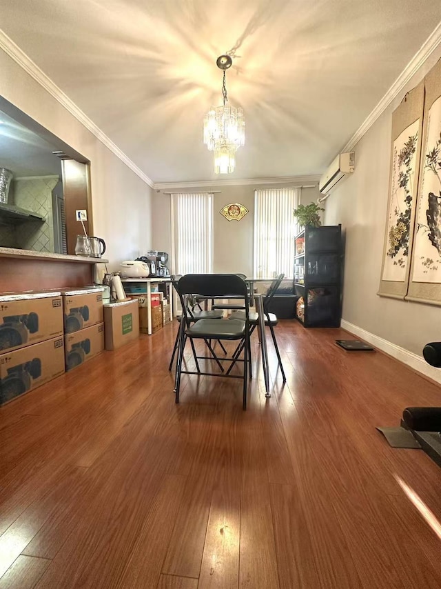 dining area with crown molding, wood-type flooring, and a notable chandelier