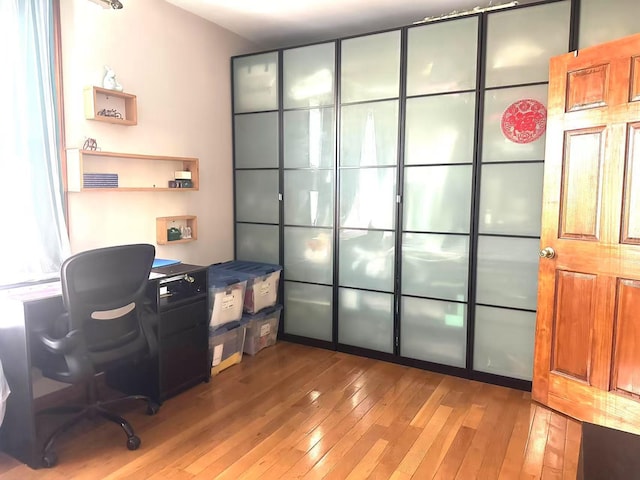 office space with light hardwood / wood-style flooring