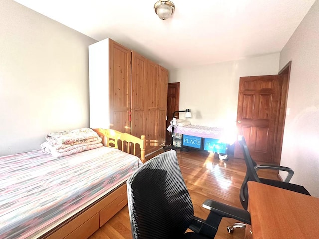 bedroom with light hardwood / wood-style flooring