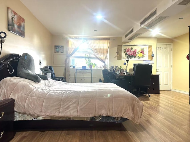 bedroom with hardwood / wood-style floors