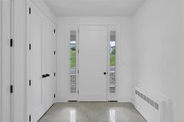 foyer entrance featuring radiator