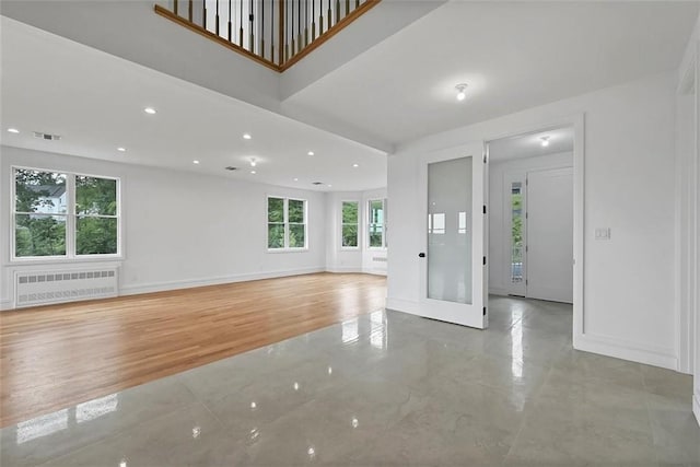 unfurnished living room with radiator