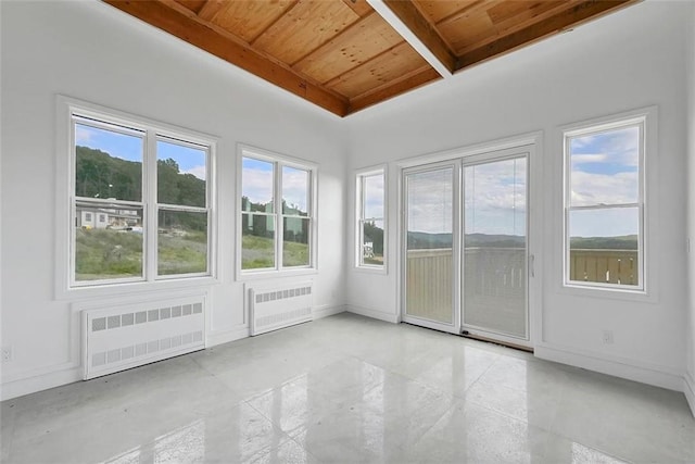 unfurnished sunroom with wood ceiling and radiator