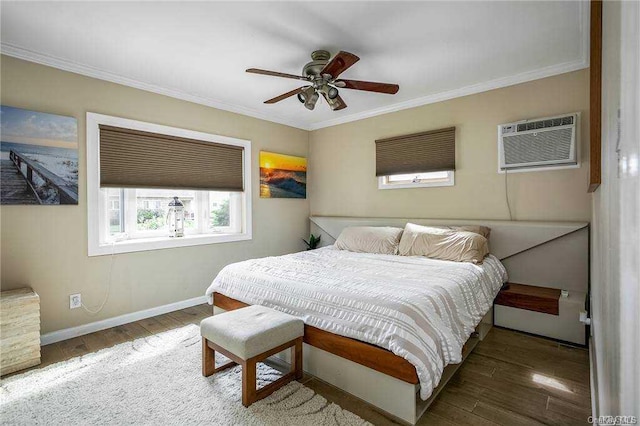 bedroom with ceiling fan, crown molding, dark wood-type flooring, and a wall mounted air conditioner