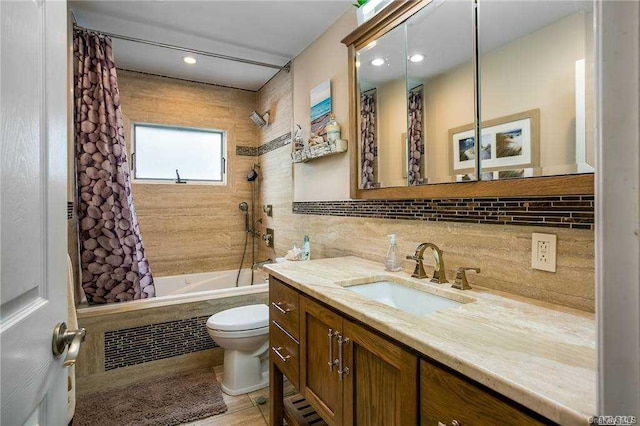 full bathroom featuring vanity, toilet, shower / bath combination with curtain, and decorative backsplash