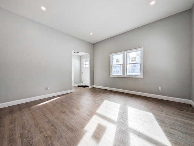 unfurnished room featuring hardwood / wood-style flooring