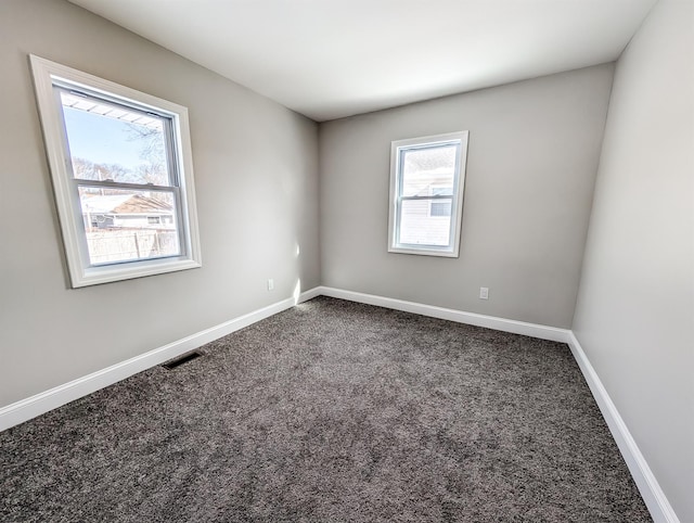 unfurnished room featuring carpet flooring