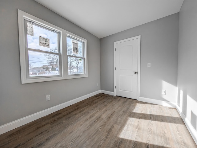 empty room with light hardwood / wood-style flooring