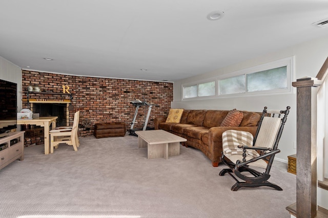 carpeted living room with brick wall