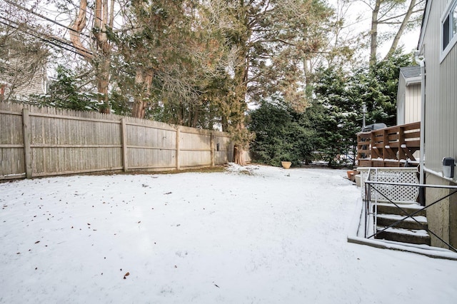 view of yard layered in snow