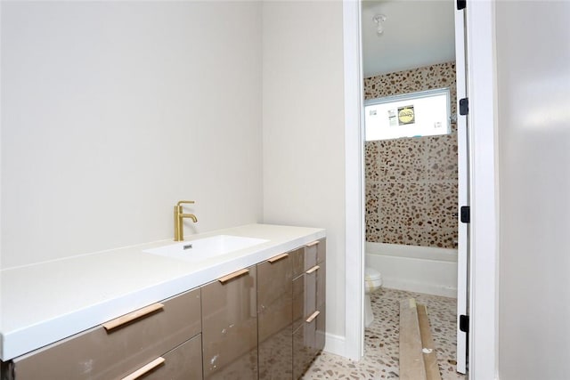 full bathroom with vanity, toilet, tiled shower / bath combo, and tile patterned flooring