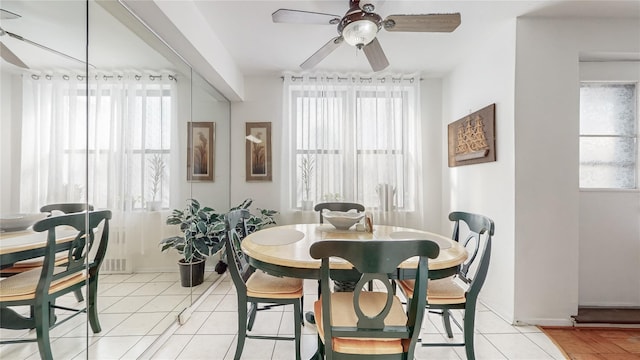 dining room with ceiling fan and light tile patterned floors