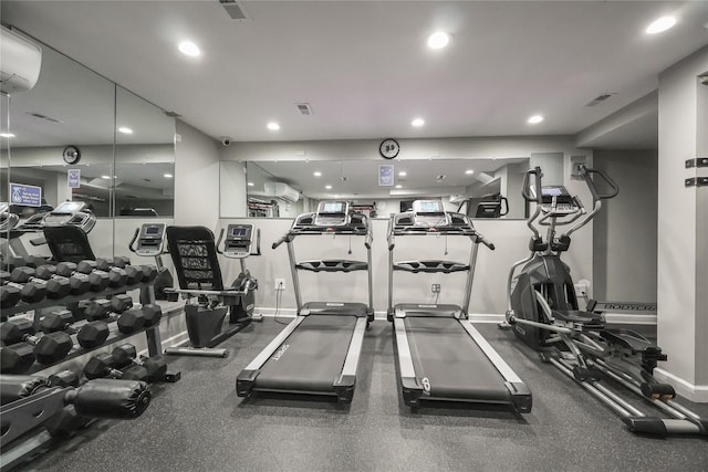 exercise room with a wall unit AC