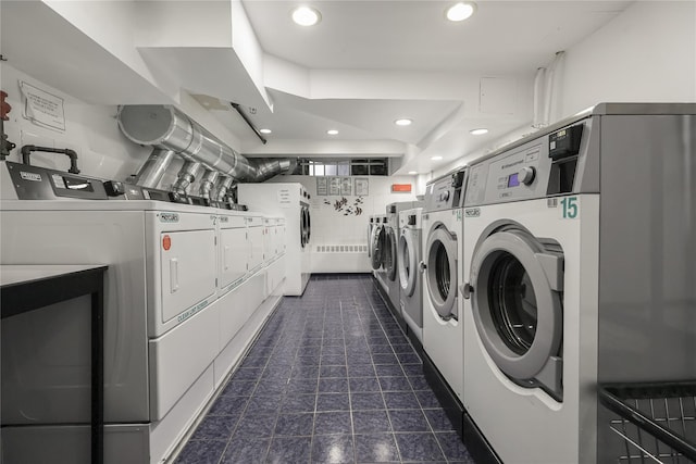 clothes washing area featuring washing machine and clothes dryer