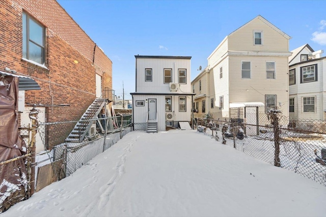 view of snow covered house