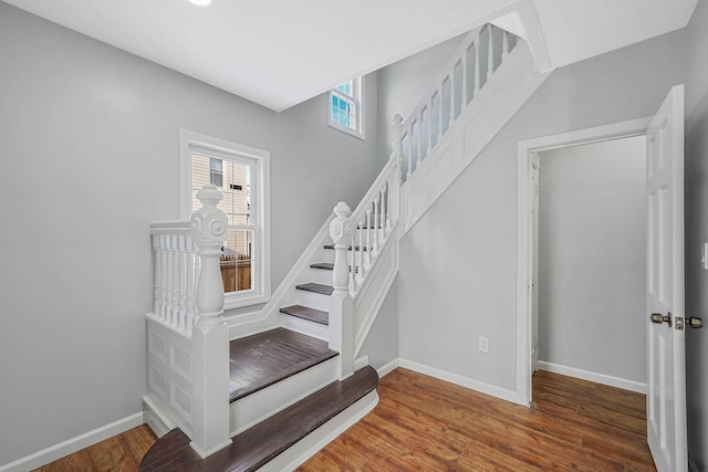 stairs with wood-type flooring