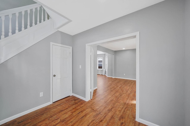 additional living space featuring wood-type flooring