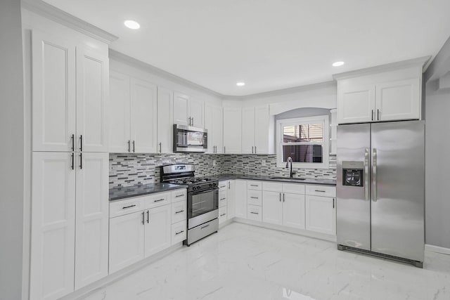 kitchen with sink, white cabinetry, and appliances with stainless steel finishes