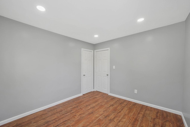 empty room with wood-type flooring