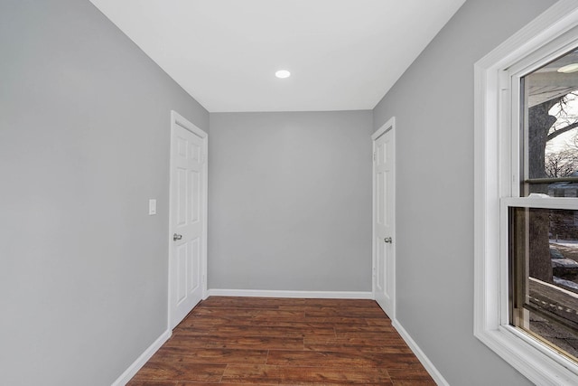 corridor featuring dark hardwood / wood-style floors