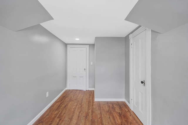 hall with dark wood-type flooring