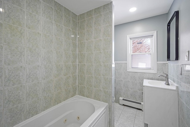 bathroom featuring tile patterned floors, tile walls, baseboard heating, and vanity