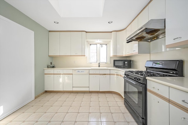 kitchen with sink, black appliances, white cabinets, and light tile patterned floors