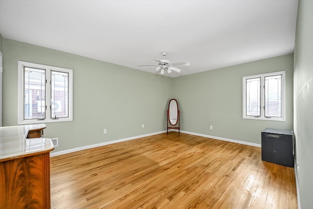 interior space featuring light wood-type flooring and ceiling fan