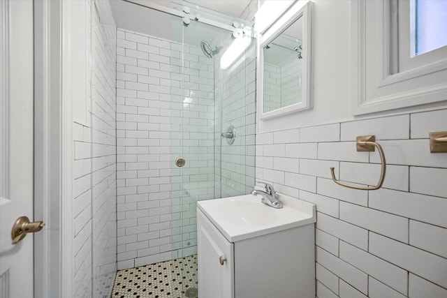 bathroom featuring vanity and a tile shower