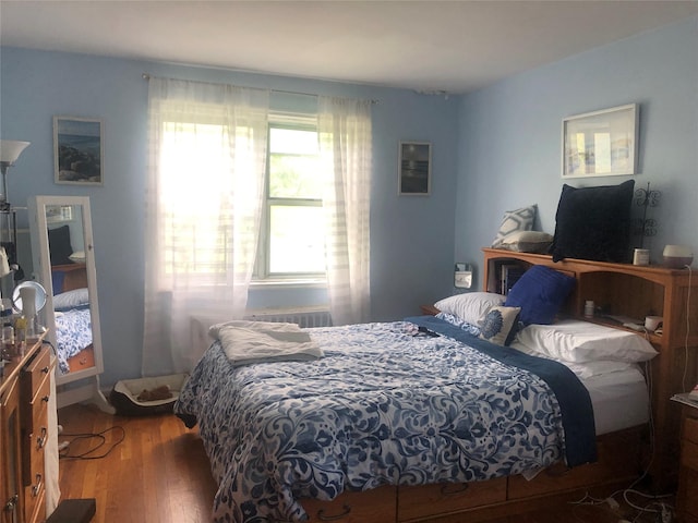 bedroom with hardwood / wood-style floors