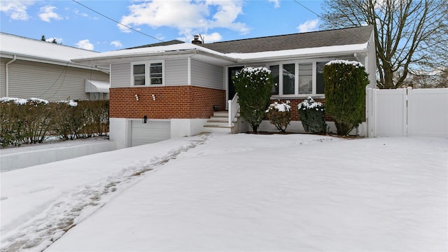 bungalow featuring a garage