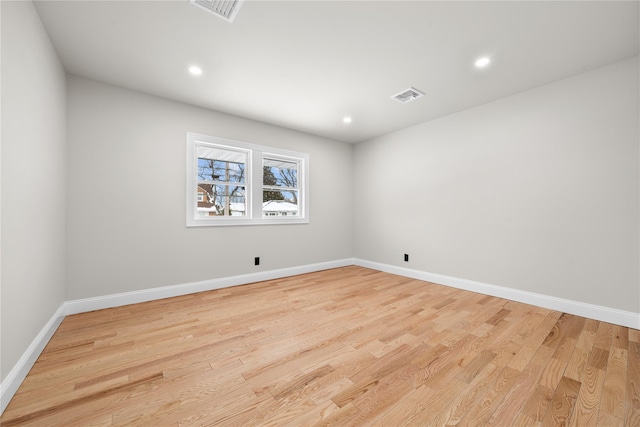 unfurnished room with light wood-type flooring