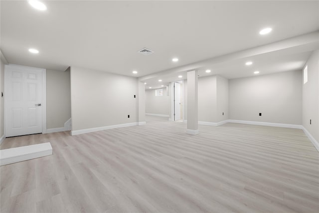 basement featuring light hardwood / wood-style flooring