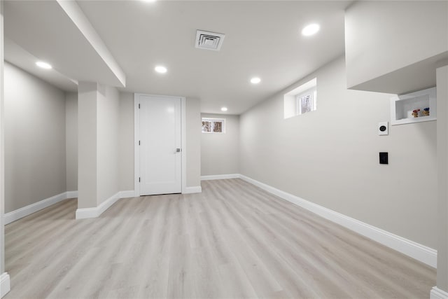 basement featuring light hardwood / wood-style floors