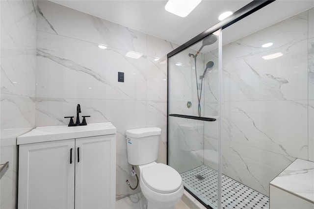 bathroom with vanity, toilet, and an enclosed shower