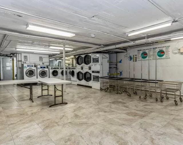 clothes washing area featuring washer and clothes dryer