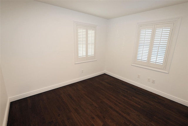 unfurnished room with hardwood / wood-style floors