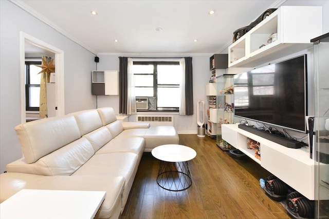 living room featuring cooling unit, radiator heating unit, ornamental molding, and dark hardwood / wood-style floors